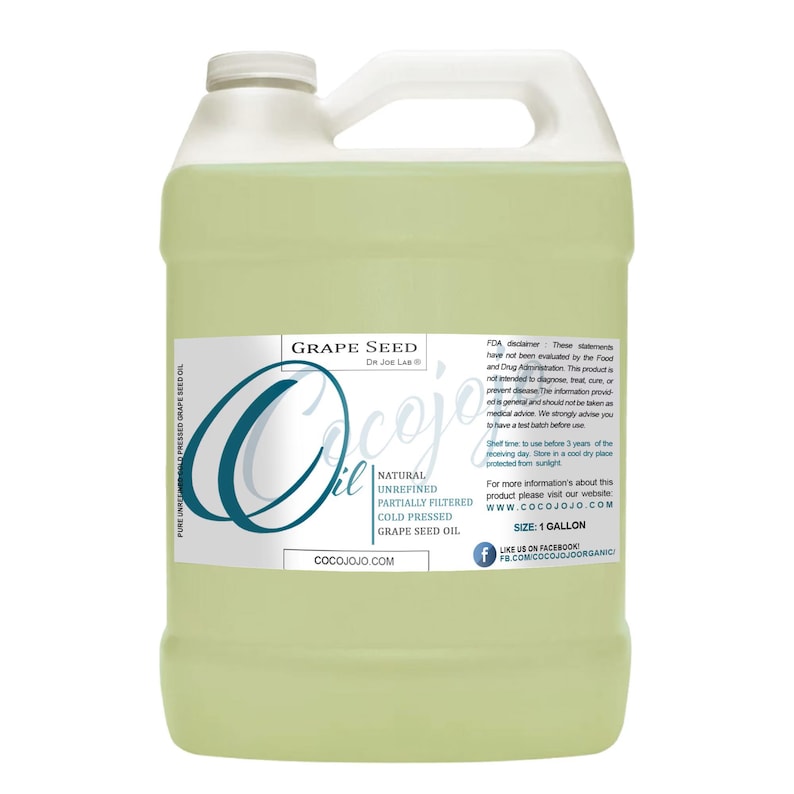 May include: A clear, one-gallon jug of Cocojojo Grape Seed Oil. The label features the brand name in a stylized teal font, along with product details: natural, unrefined, partially filtered, and cold-pressed. The jug has a white handle and a white cap.