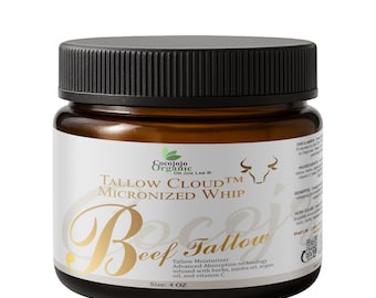 以下が含まれることがあります： Cocojojo Organic Tallow Cloud Micronized Whip Beef Tallow保湿クリームのジャー。ラベルにはテキストと牛のイラストが描かれています。ジャーは118mlです。