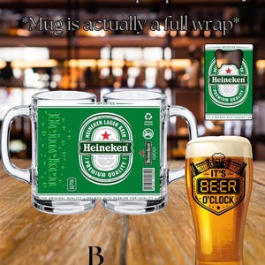 May include: A clear glass beer mug featuring a green Heineken label wrap with the text Heineken Lager Beer Premium Quality, a small bottle opener with a Heineken logo, and a tall beer glass with the text It's Beer O'Clock in a black shield.