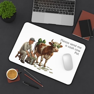 May include: White rectangular mousepad featuring a cartoon illustration of a farmer milking a cow wearing dollar sign sunglasses. The cow has a green bow and is surrounded by money. Text reads, "Please send me a cash cow Pal."