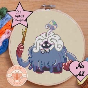 May include: Cross-stitch pattern featuring a blue and white pixelated creature holding a wooden staff, set in a wooden embroidery hoop. The image includes text that says "PDF Instant Download" and "No AI". Colorful embroidery floss surrounds the hoop.