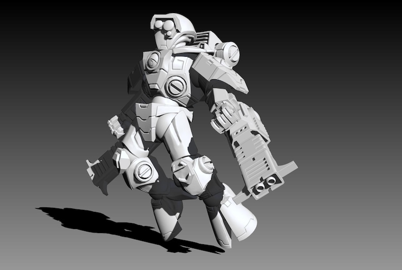 May include: A white, unpainted miniature figurine of a futuristic armored soldier in a dynamic pose. The figure features a helmet with circular sensors, a chest plate, shoulder pauldrons, and large, blocky weapons attached to both arms.