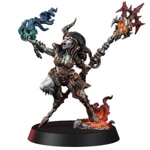 May include: A fantasy miniature figure of a pale-skinned warrior with dark hair and horns, wearing dark armour with red accents. The figure holds a staff topped with a glowing skull and casts blue magical flames from the other hand, standing on a base.