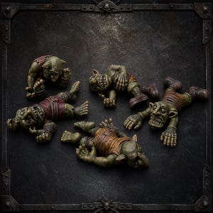 May include: A set of four green-skinned goblin figurines in various prone and seated positions. Each creature features pointed ears, sharp teeth, and wears brown or reddish-brown clothing. The figures are arranged on a dark, textured surface.