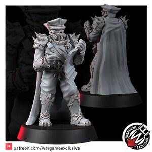 May include: A grey resin miniature figure of a military officer wearing a peaked cap, a skull-like face mask, and spiked shoulder armor. The figure holds a map and a pen, wears a long cape, and stands on a circular black base with detailed boots.