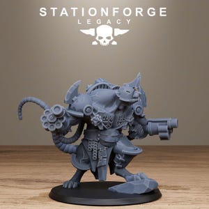May include: A grey resin miniature of a bipedal rat creature in armour, featuring a multi-barrelled rotary weapon on one arm and a pistol on the other. The figure stands on a circular base with a rock detail, displaying the text STATIONFORGE LEGACY.