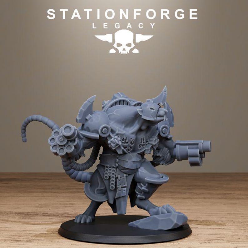 May include: A grey resin miniature of a bipedal rat creature in armour, featuring a multi-barrelled rotary weapon on one arm and a pistol on the other. The figure stands on a circular base with a rock detail, displaying the text STATIONFORGE LEGACY.