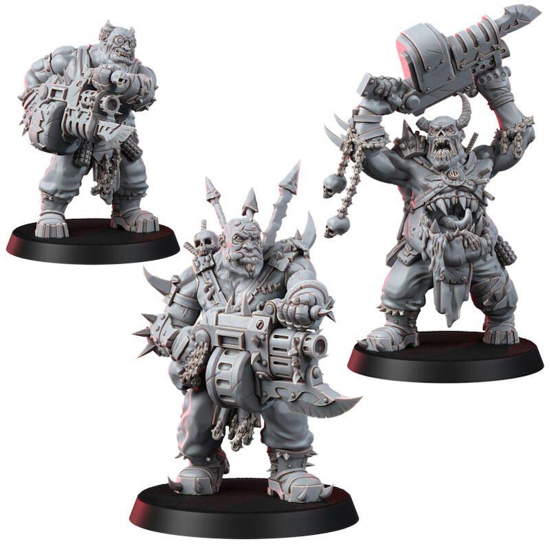 May include: Three unpainted gray miniature figures of muscular humanoid creatures with tusks and horns. Two figures hold large mechanical heavy weapons, while the third figure raises a massive bladed hammer overhead, adorned with hanging skull charms.
