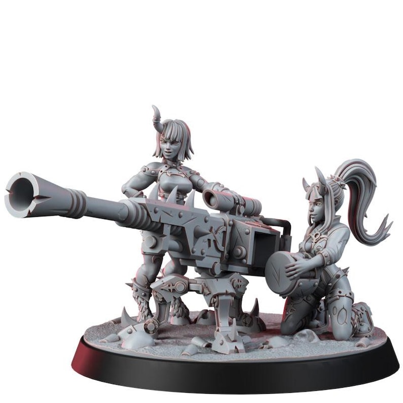May include: A grey miniature figurine set featuring two horned figures operating a large, heavy-duty mounted cannon. One figure stands behind the weapon while the other kneels to load a circular ammunition drum. The piece is set on a round base.