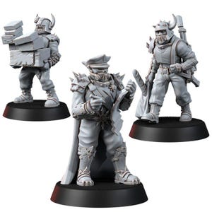 May include: Three unpainted gray miniature figures standing on black circular bases. One figure carries a stack of boxes, another wears a peaked cap and cape while holding a document, and the third wears a horned helmet and carries a baguette.