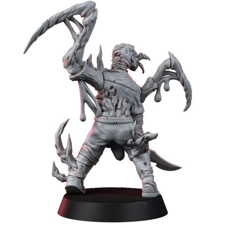 May include: A grey unpainted miniature figure of a humanoid creature with elongated, claw-like appendages extending from its back and arms. The figure stands on a circular black base, featuring textured, organic-looking growths on its torso.