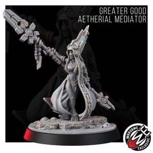 May include: A gray miniature figurine titled Greater Good Aetherial Mediator, featuring a character in a tall headdress holding a long staff with geometric details. The figure stands on a textured base with a Wargame Exclusive logo in the corner.