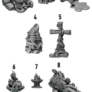 May include: A collection of ten grey miniature resin terrain pieces from Greytide Studio, featuring gothic elements like a face with roses, a skull, a spilled chalice, stone ruins, a cross, a flaming brazier, a candle, and ornate pillars.