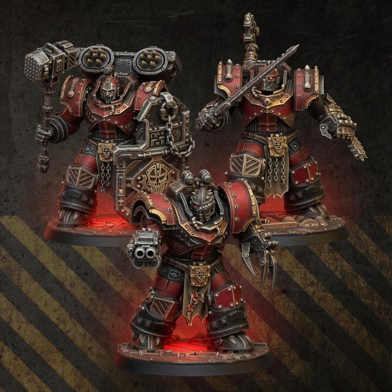 May include: Three miniature warrior figurines in heavy red and black armor with metallic gold trim. One figure holds a large hammer and shield, another wields a sword and clawed gauntlet, and the third carries a double-barreled firearm.