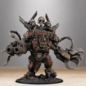 May include: A miniature figurine of a green-skinned armored warrior featuring a large multi-barreled cannon on the right arm and a mechanical claw on the left. The figure wears dark red metal plating, adorned with three skulls on the shoulder area.