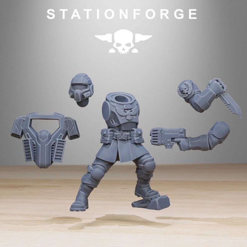 May include: A grey resin miniature model kit labelled STATIONFORGE, featuring a torso with an eagle emblem, legs, a helmet, a chest plate, and two arms. One arm holds a firearm, while the other holds a combat knife with a skull detail on the shoulder.