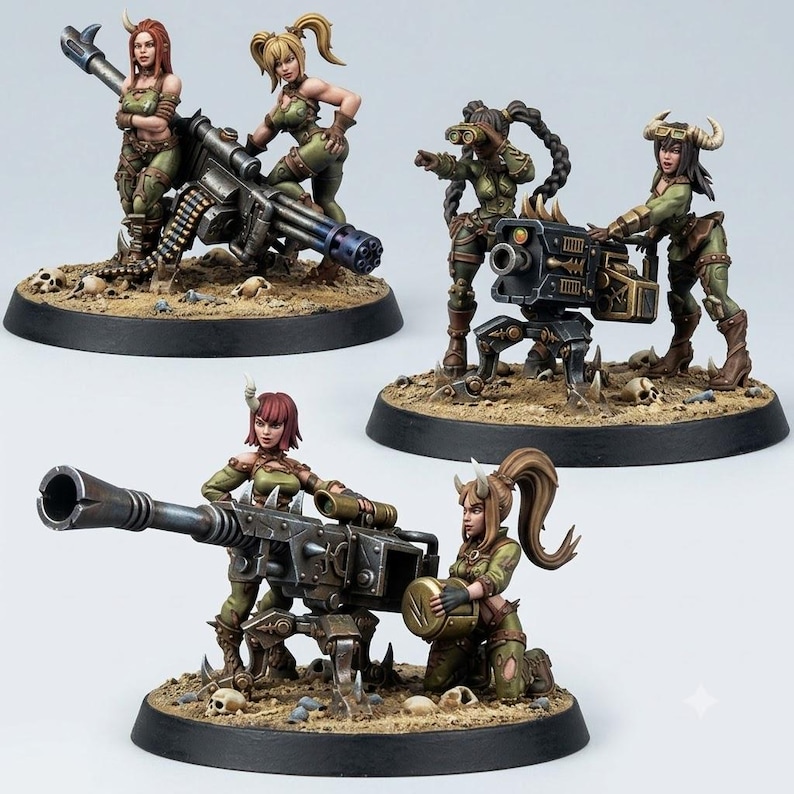 May include: Three sets of miniature figurines featuring female characters with horns, dressed in olive green tactical gear. Each set includes a heavy weapon, such as a gatling gun or cannon, mounted on a circular base with a sandy, skull-strewn terrain.
