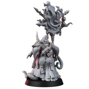 May include: A gray resin miniature figure of a hooded character wearing a long robe with a back-mounted tank and tubing. The figure holds a tall staff topped with a large, swirling flame-like structure and stands on a circular base.