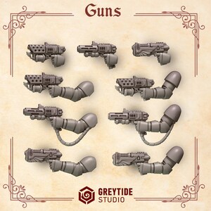 May include: A collection of eight grey miniature plastic guns, some attached to robotic arms with shoulder pads, arranged in rows. The top text reads Guns and the bottom logo reads GREYTIDE STUDIO. The items feature various barrel designs.