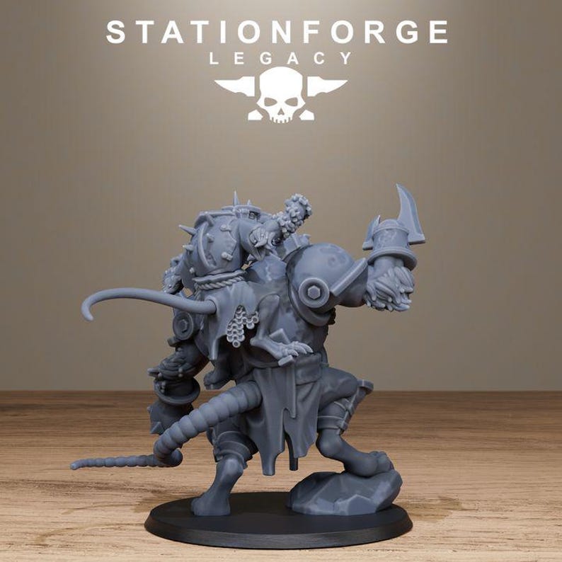 May include: A grey resin miniature figurine of a rat-like creature in armour, featuring a long tail, spiked shoulder pauldrons, and a blade held in one hand. The figure stands on a circular base with the text STATIONFORGE LEGACY and a skull logo.