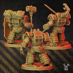 May include: Three tan-colored miniature figures of armored soldiers standing on circular bases. The figures feature heavy plating, mechanical backpacks, and various weapons including a large hammer, a sword, and a clawed gauntlet.