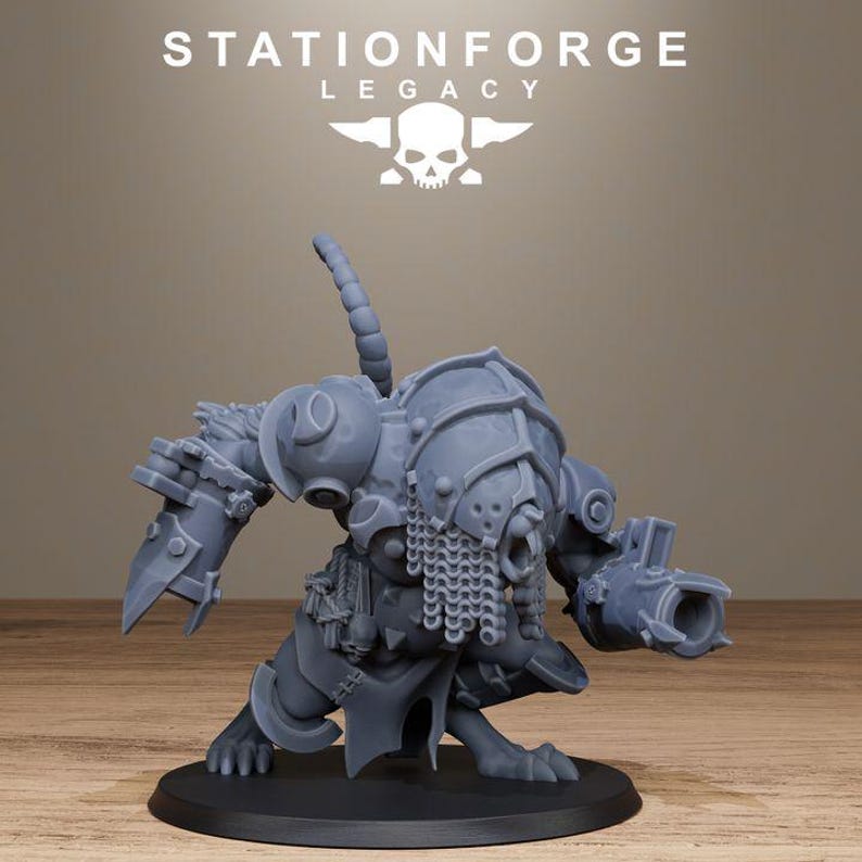 May include: A grey resin miniature figure of a rat-like creature in armour, featuring a chainmail face covering, a mechanical claw on one arm, and a cannon on the other. The figure stands on a circular base with the text STATIONFORGE LEGACY above.