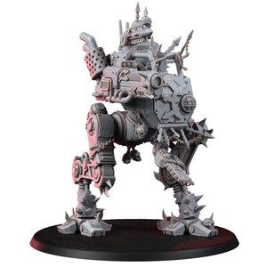 May include: A gray plastic miniature of a bipedal mechanical walker featuring spiked armor plating, a large front-mounted cannon, exhaust pipes, and decorative skull motifs. The war machine stands on two articulated legs with clawed feet.