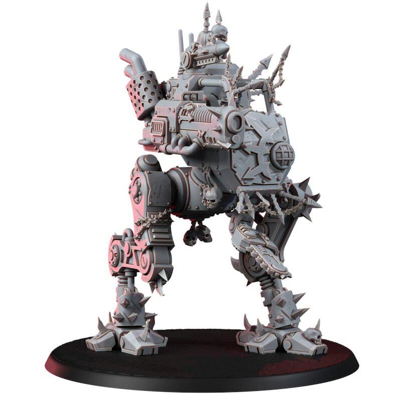 May include: A gray plastic miniature of a bipedal mechanical walker featuring spiked armor plating, a large front-mounted cannon, exhaust pipes, and decorative skull motifs. The war machine stands on two articulated legs with clawed feet.