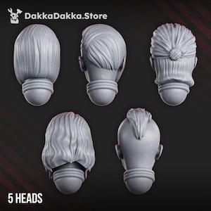 May include: Five grey miniature heads with distinct hairstyles, including a bob, a side-parted style, a tied-back bun, wavy hair, and a mohawk. Each head features a neck collar detail. The text DakkaDakka.Store and 5 HEADS are visible.