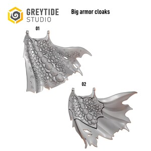 May include: Two grey miniature cloaks labeled 01 and 02, featuring a textured scale pattern and tattered edges. The text GREYTIDE STUDIO and Big armor cloaks appear at the top. These sculpted pieces are designed for tabletop gaming figures.