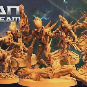 May include: A collection of detailed, tan-colored alien figurines, each posed dynamically with weapons. The figures are on circular bases, with the text "FRAN NINETEAM" at the top. The overall theme suggests a science fiction or tabletop gaming product.