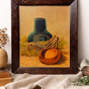 May include: A framed still life painting featuring a dark green vase, a small orange bowl, and dried branches. The painting has a warm color palette with a brown wooden frame.