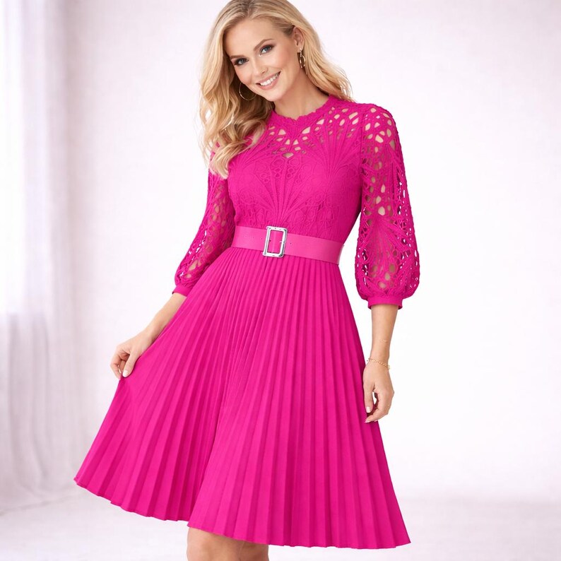 May include: A bright pink dress with a pleated skirt and a fitted bodice. The dress features a matching belt with a silver buckle and lace sleeves. The dress is knee-length and has a feminine, elegant style.