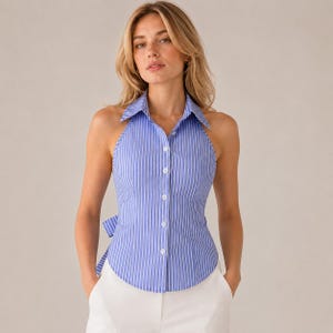 May include: A sleeveless button-down shirt featuring a blue and white vertical striped pattern, a classic collar, and a fitted silhouette. The garment includes a tie-back detail at the waist and a front button placket with white buttons.