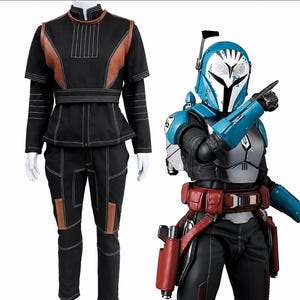 May include: A black long-sleeved top and pants set with brown accents and white stitching, displayed alongside a figure wearing a blue and white helmet, silver chest armor, red utility belt, and blue gauntlets with a pointing gesture.