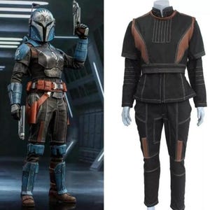 May include: A full-body costume set featuring a blue and grey helmet with a visor, matching blue and grey armor plates, a brown utility belt, and a black long-sleeved top and pants with brown accents and visible white stitching throughout the garment.