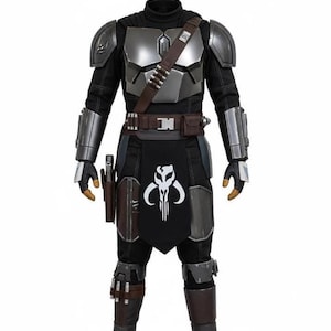 May include: A full-body costume featuring a black and silver color scheme. The costume includes a black turtleneck, silver chest and shoulder armor, and a black apron with a white skull emblem. A brown belt and holster complete the look.