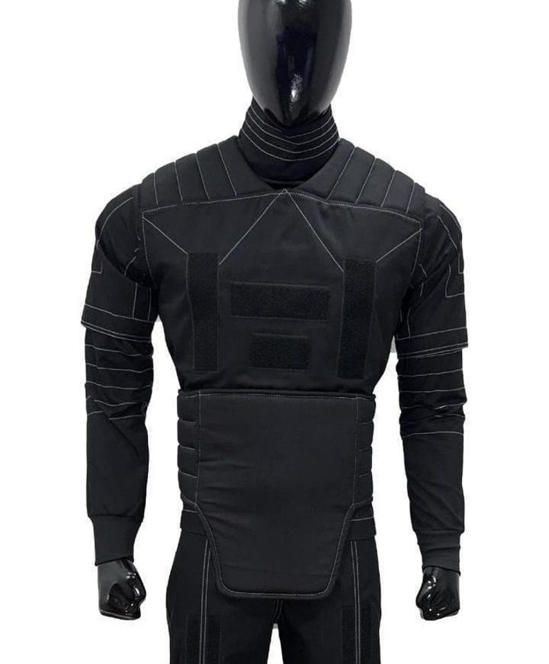 May include: A black tactical-style long-sleeve shirt and vest set featuring a high mock neck collar, padded shoulder panels, and a structured midsection. The garment is accented with white contrast stitching throughout and rectangular velcro patches.