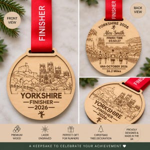 May include: A round wooden finisher medal with a red ribbon, featuring a laser-engraved illustration of a cathedral and bridge. The text reads YORKSHIRE FINISHER 2026. The back view shows personalized details including a name, finish time, and 26.2 Miles.