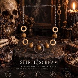 May include: A necklace featuring a silver chain with alternating light-colored wooden rings and speckled brown resin beads. The central focal point is a dark, textured ring containing a single brown resin bead. Text reads SPIRIT SCREAM TRAPPED SOUL SONIC PENDANT.