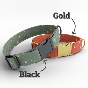 May include: Two pet collars featuring a moon and star pattern. One collar is sage green with black hardware, and the other is terracotta orange with gold hardware. Each collar includes a side-release buckle, a metal D-ring, and an adjustable slider.