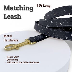 May include: A 5 ft long leash featuring a dark navy fabric with a white crescent moon and star pattern. The leash includes gold-toned metal hardware with a heavy-duty quick snap clip. Text on the image reads Matching Leash, 5 Ft Long, and Metal Hardware.