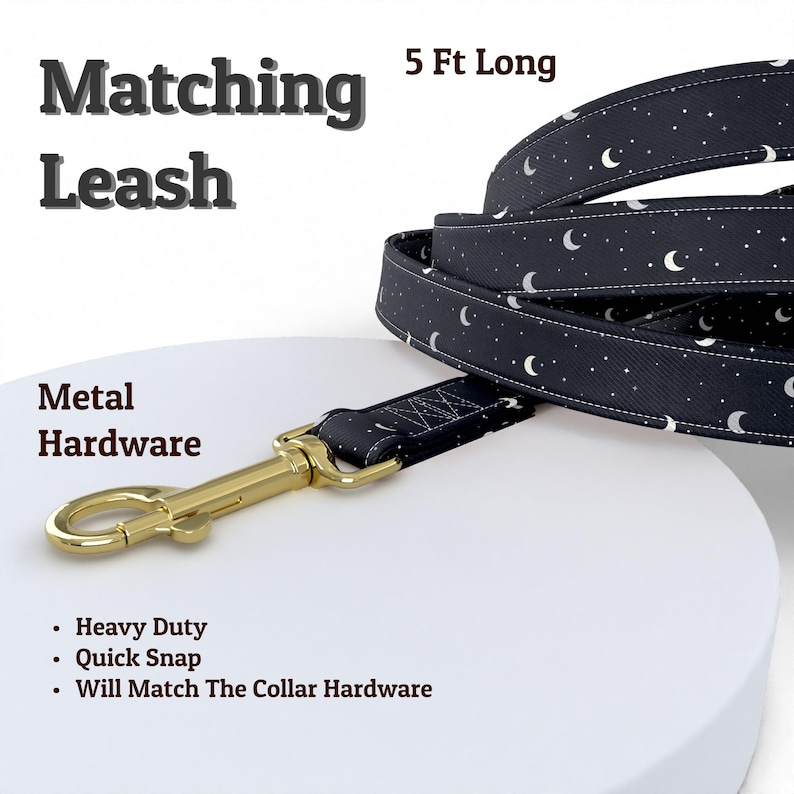 May include: A 5 ft long leash featuring a dark navy fabric with a white crescent moon and star pattern. The leash includes gold-toned metal hardware with a heavy-duty quick snap clip. Text on the image reads Matching Leash, 5 Ft Long, and Metal Hardware.