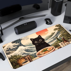 May include: A rectangular desk mat featuring a black cat with large eyes, a bowl of ramen, and Japanese-style art of waves and a sunset. The mat includes bottles and a wooden barrel. The mat is surrounded by computer accessories.