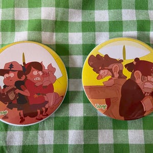 May include: Two circular badges featuring cartoon characters. One shows three characters with a pig, the other shows two characters. The badges have a yellow background with a white border and the text "tssgo".