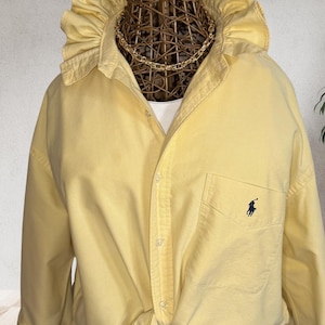 May include: A rustic wooden sign with the text "Welcome to our home" in white lettering. The sign features a distressed finish and a simple, inviting design, perfect for a front porch or entryway.