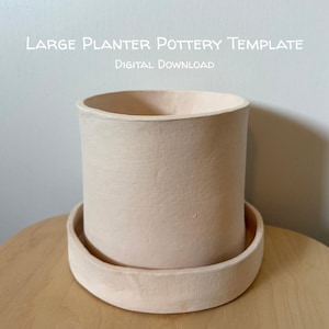 May include: A light beige cylindrical ceramic planter with a matching circular saucer base. The text "LARGE PLANTER POTTERY TEMPLATE" and "DIGITAL DOWNLOAD" is printed in white above the planter against a plain background.