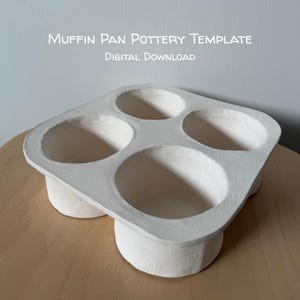 May include: A white, square-shaped ceramic muffin pan pottery template with four circular, deep-set wells. The text "Muffin Pan Pottery Template" and "Digital Download" is printed in white above the object against a light background.