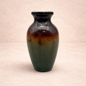 May include: A set of three ceramic mugs with a speckled, matte finish. The mugs are in shades of cream, light gray, and dark gray. Each mug has a simple, minimalist design, perfect for coffee or tea.