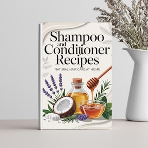May include: A book titled "Shampoo and Conditioner Recipes" with illustrations of natural ingredients like coconut, honey, and lavender. A white vase with lavender sprigs sits to the right. The book cover features a light beige background.